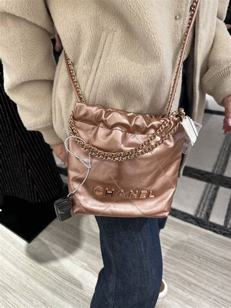 peach chanel bag|Chanel 22 mini handbag.